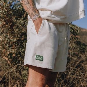 Daily Drills Cream Athletic Shorts with Green Patch